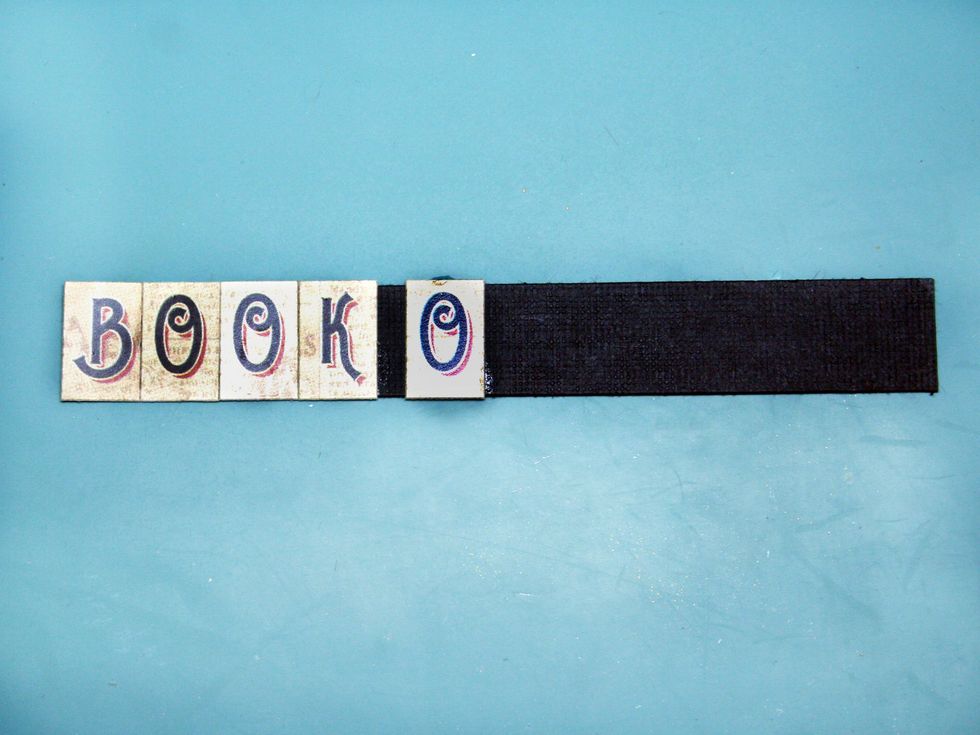 Prepare your title. I find it easier to line up my letters on a strip of paper slightly smaller than the height of the letters. I also glue the letters even though they are sticky backed.