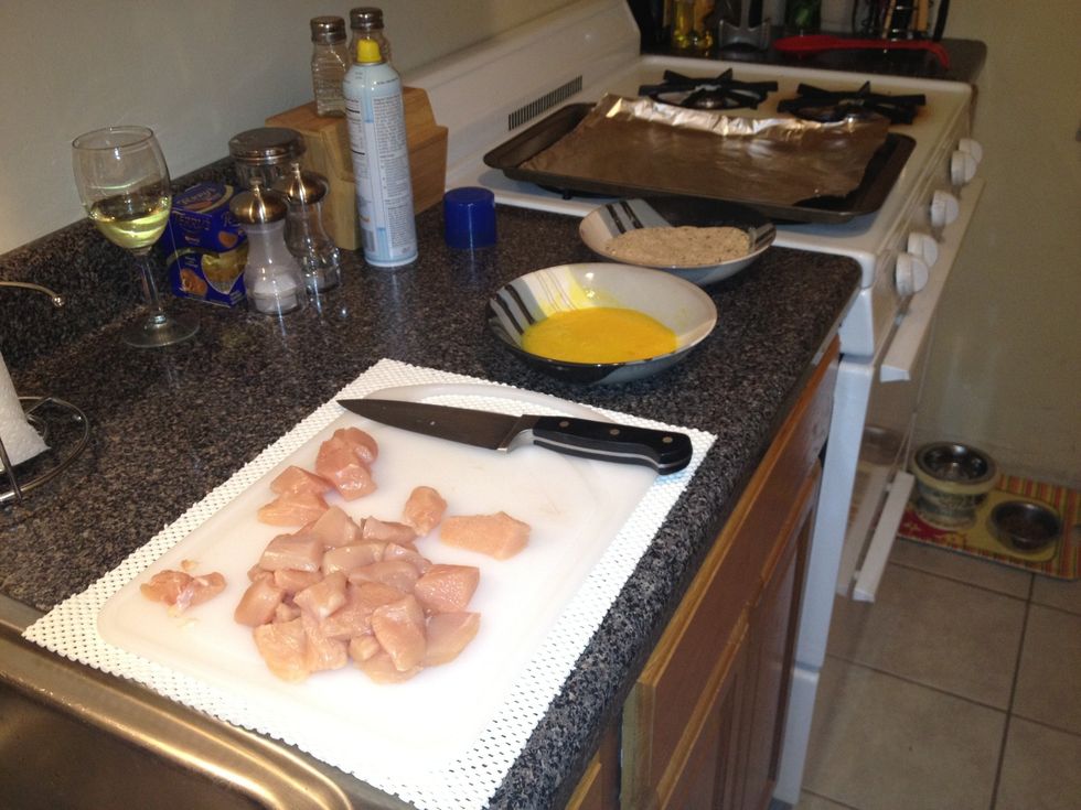 Prepare your workstation. Whip 1 egg, put bread crumbs in bowl, line baking sheet with tin foil (this reduces cleanup) and spray with cooking spray.
