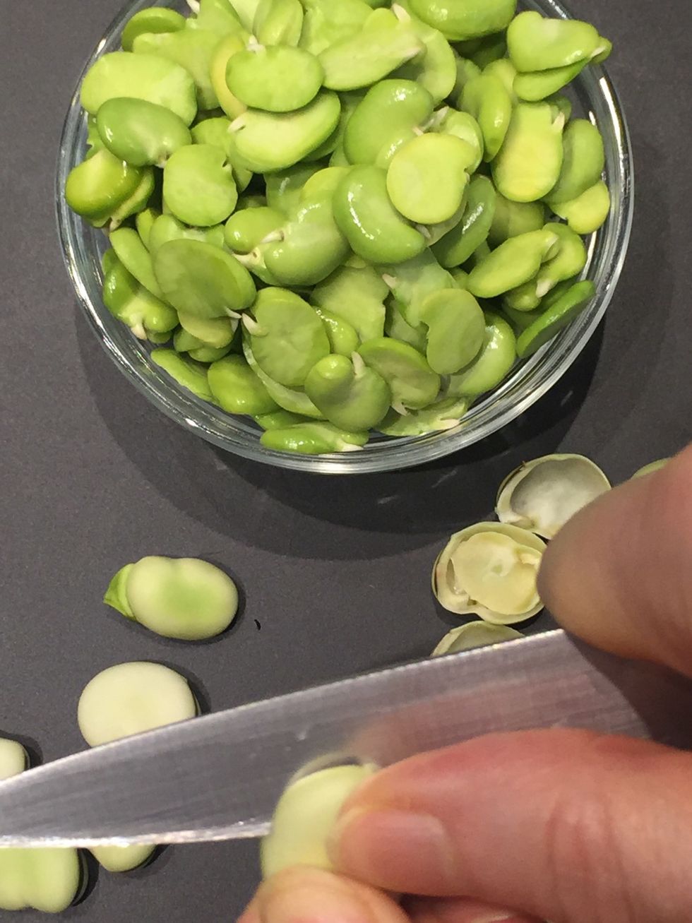 Preparing Fava beans if using.