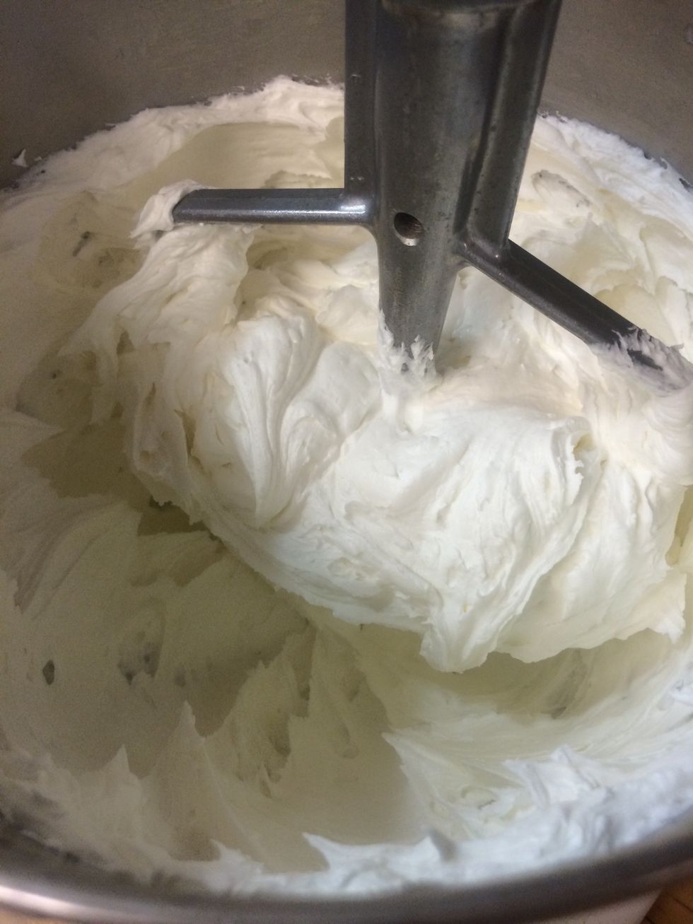 Preparing the vanilla butter cream frosting for the crumb coat and for the layer of frosting under the rolled fondant.