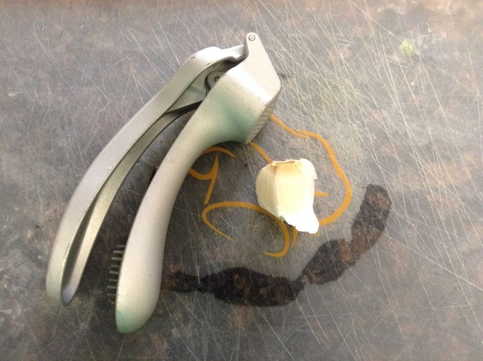 Press 1 clove garlic or mince.