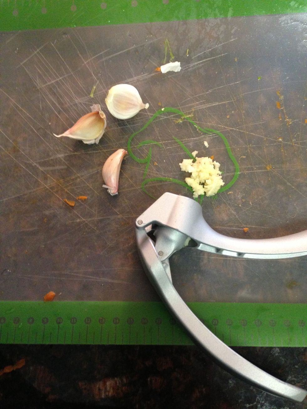 Press 4 cloves garlic. Love garlic, add extra !