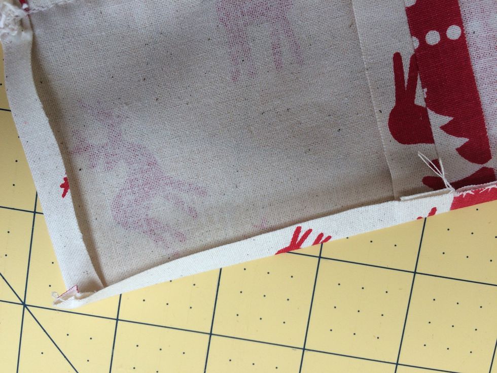 Press .5 an inch to the wrong side all around the 6 joined squares . Then press .25 of the .5 under again at the top only