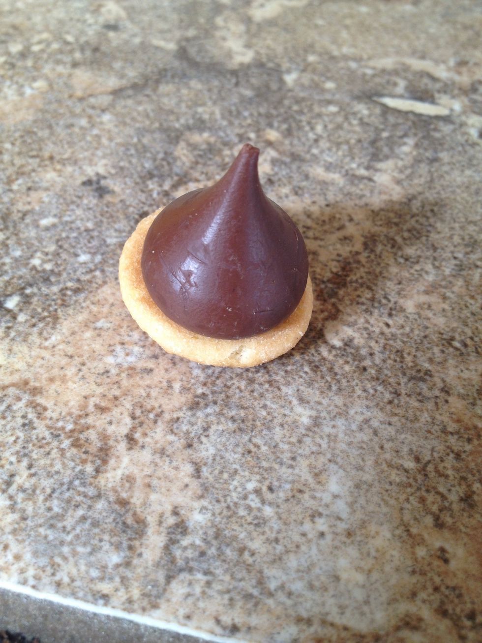 Press a kiss into the frosting.