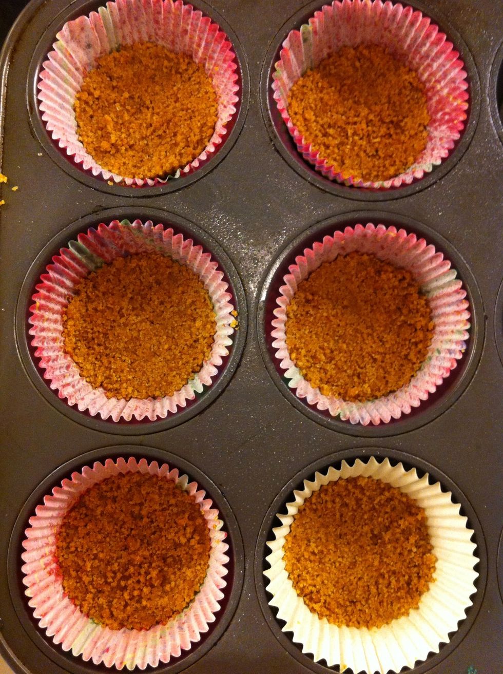 Press about 1 tbsp. of graham crumb mixture onto the bottom of cupcake liners