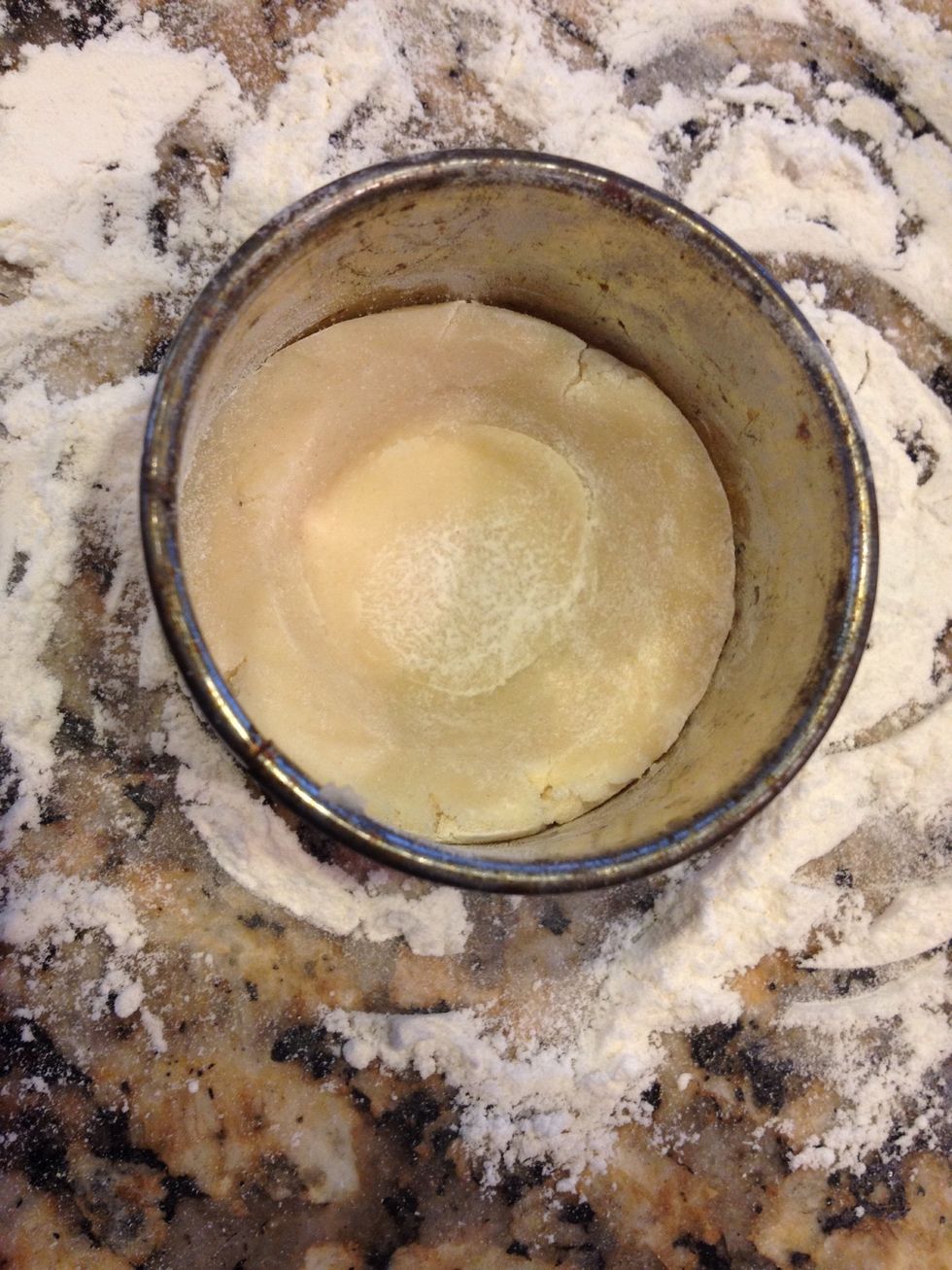 Press all around to make a circle then press down in the middle to make a well for the jelly. Be sure not to tear the dough