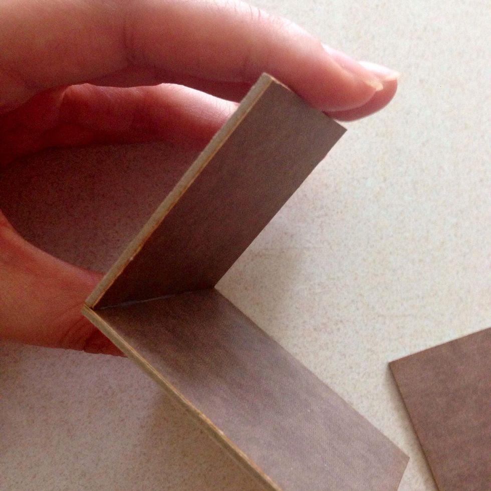 Press and glue it down at 90 degree angle on top of the 2.5" x 2" chipboard (on the 2" side)...