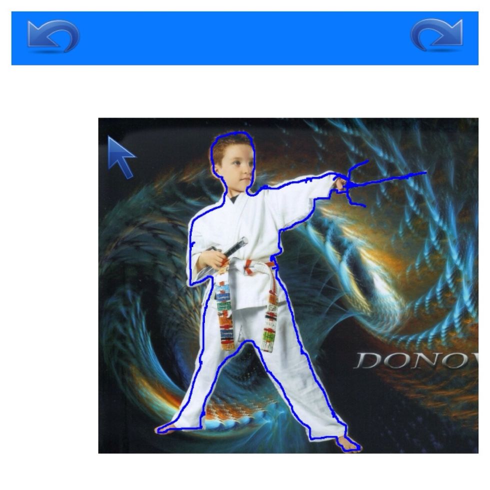 Press and hold and trace around the region you want to be cut out.  It worked better for me to be zoomed in on the image to get a better trace, moving the picture as you go, then repositioning arrow.