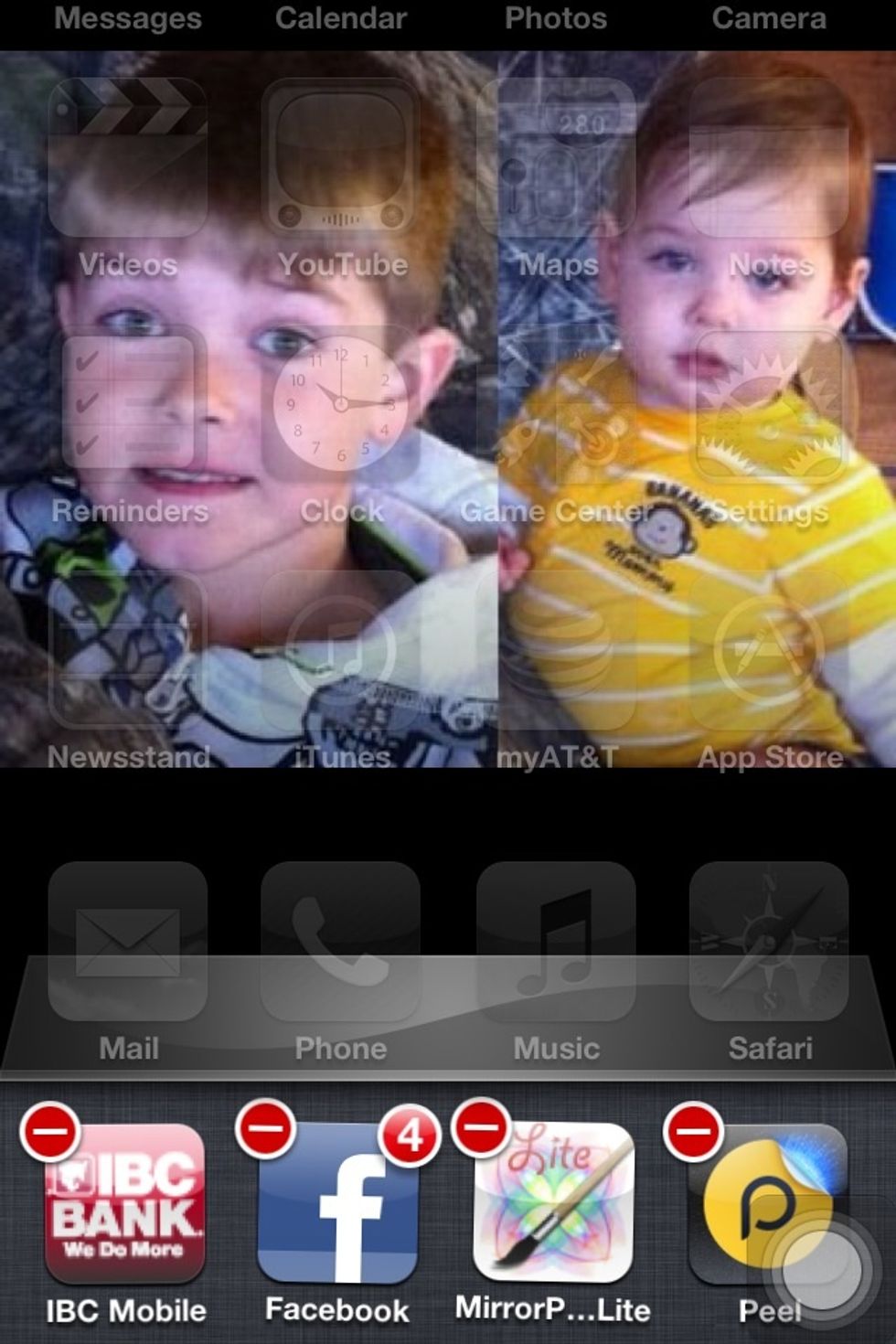 Press and hold one of the apps until the "-" sign appears.