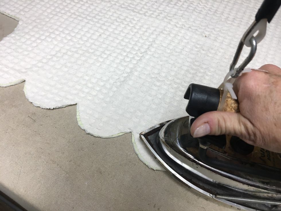 Press and steam to bond the two layers together.