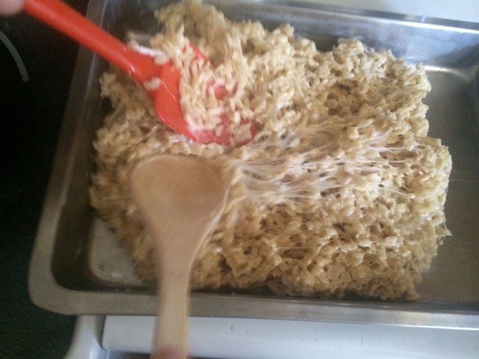 Press coated Rice cereal into pan