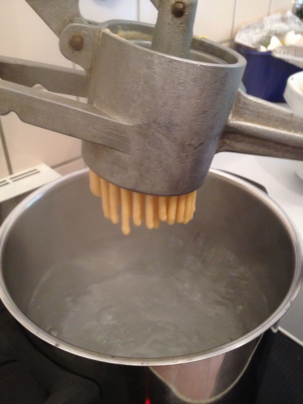 press dough in boiling water