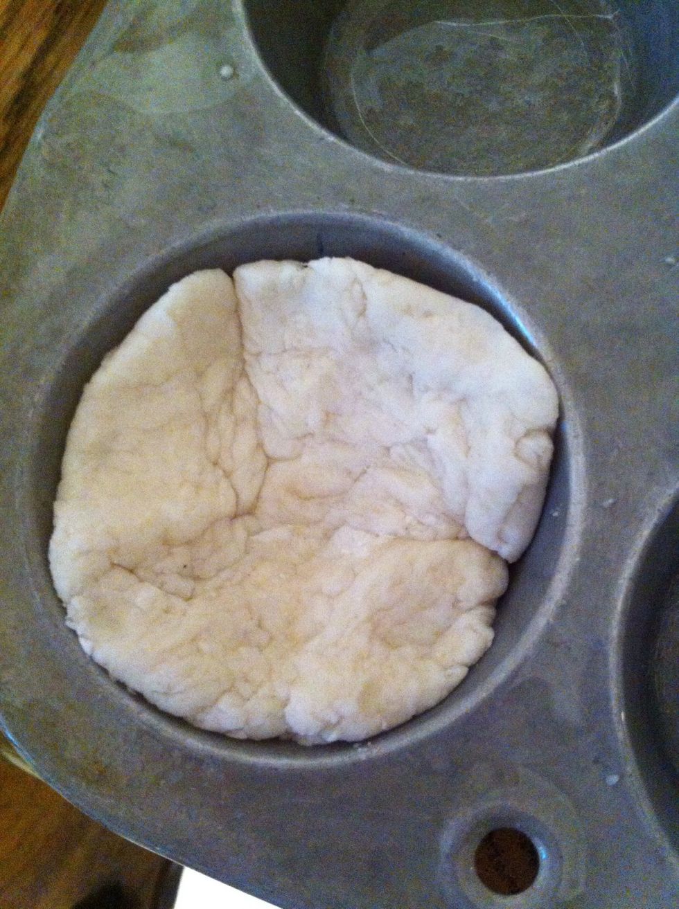 Press dough in bottom of each little cup
