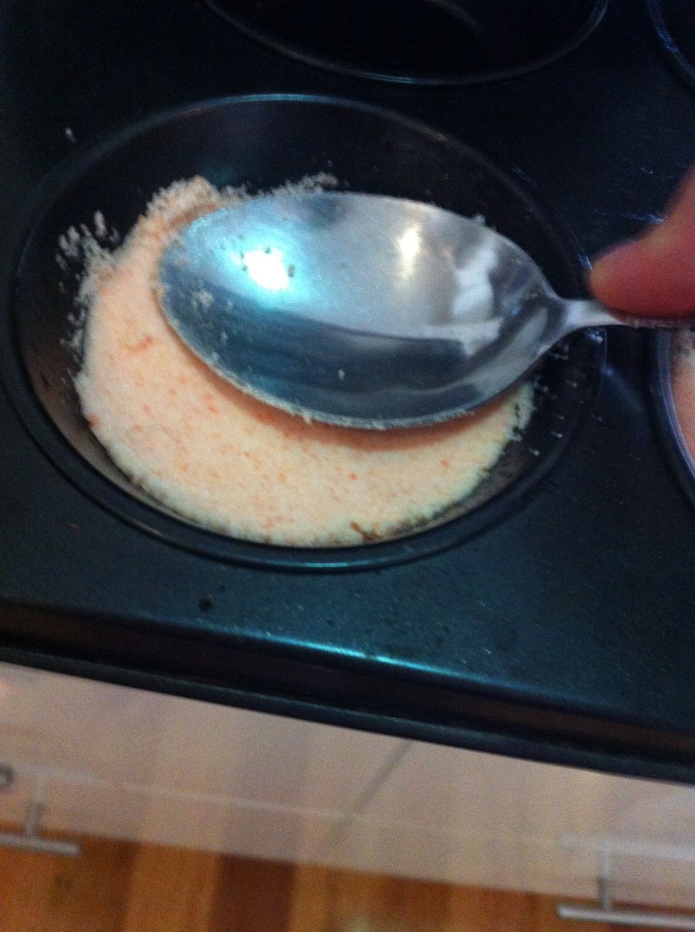 Press down firmly with the spoon.