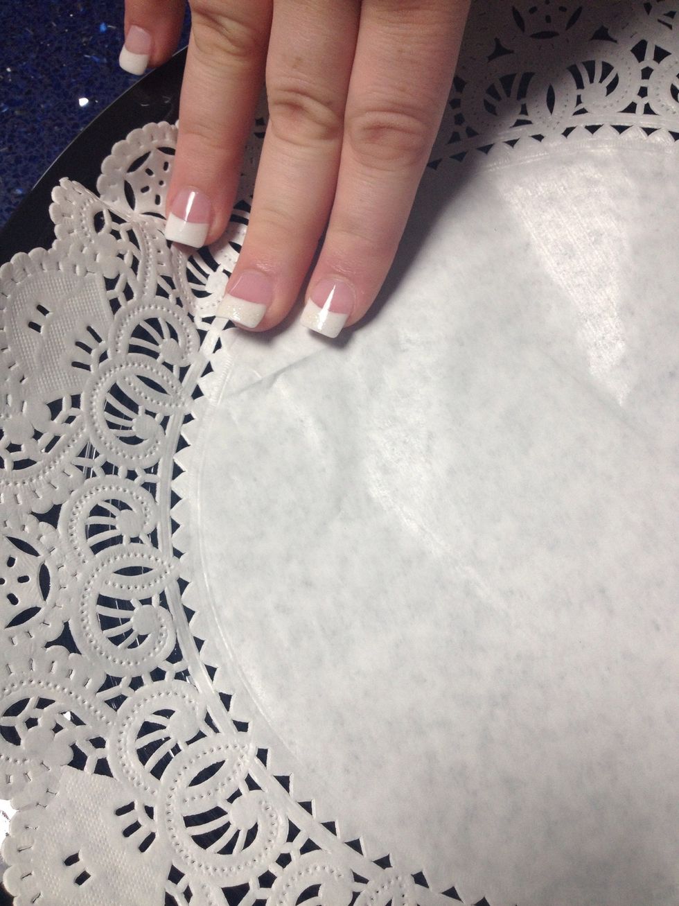 Press down on the doily over the tape so it secures the doily.