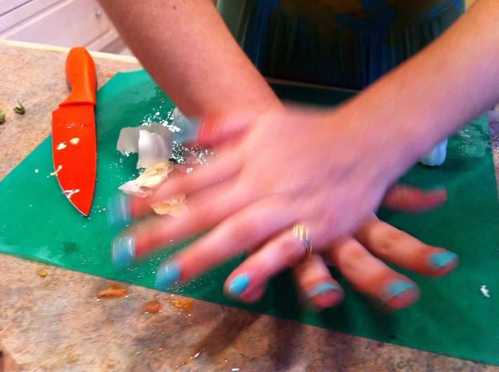 Press down on the head of garlic to separate the cloves from their shells!