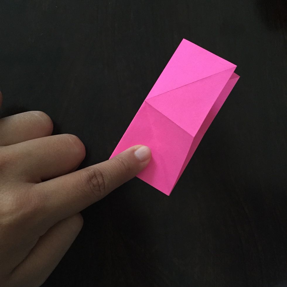 Press down on the mini triangle.