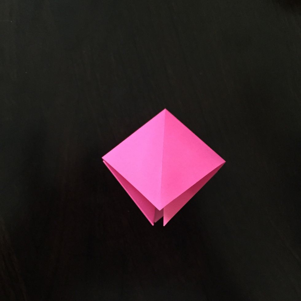 Press down on the top.