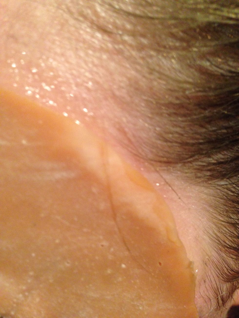 Press down the edges, and wait a couple of minutes (until you feel it's stuck on your face)