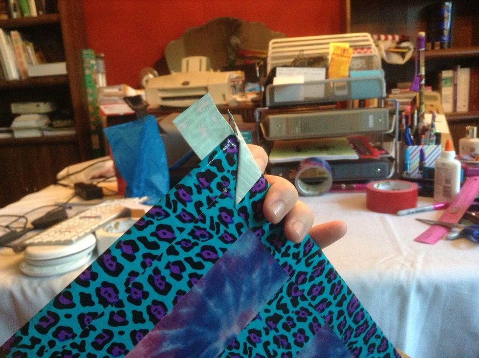 Press down the inside while keeping the fold up, and press the inside flap down INTO or UNDER the fold.