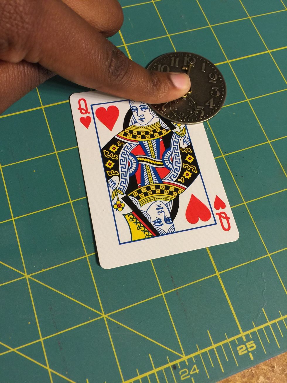 Press down to allow for bond of clock to the card.