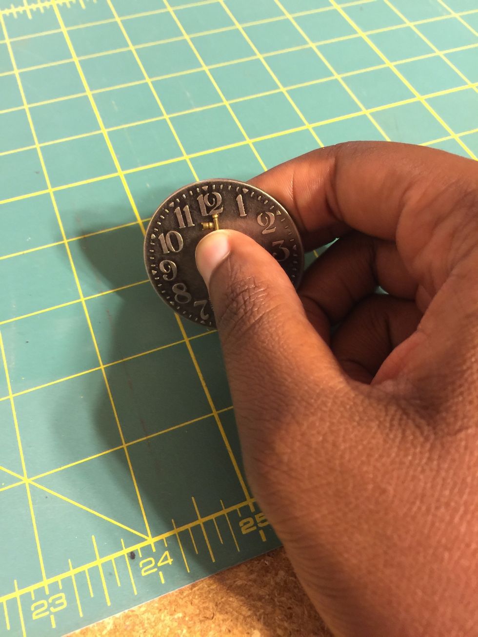 Press down to allow for bond of key to the clock.
