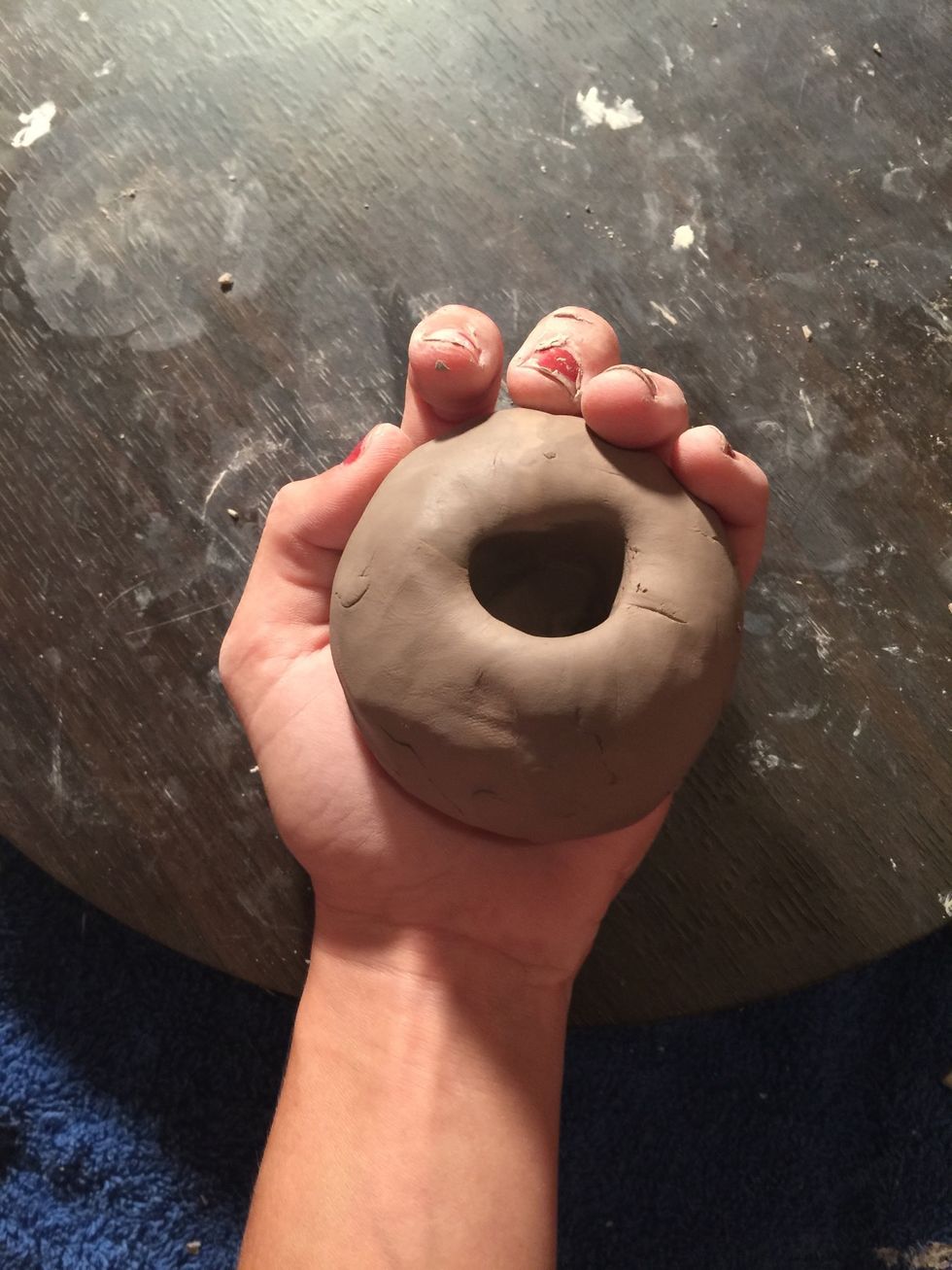 Press down until you can feel the pressure of where your thumb is on your other Palm. About half an inch thick