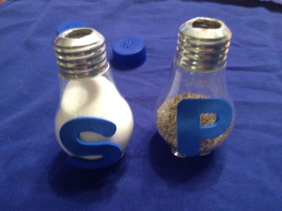 Press holes into the tops of your bottle caps with a drill or other sharp object. Then fill up each bulb with salt and pepper.