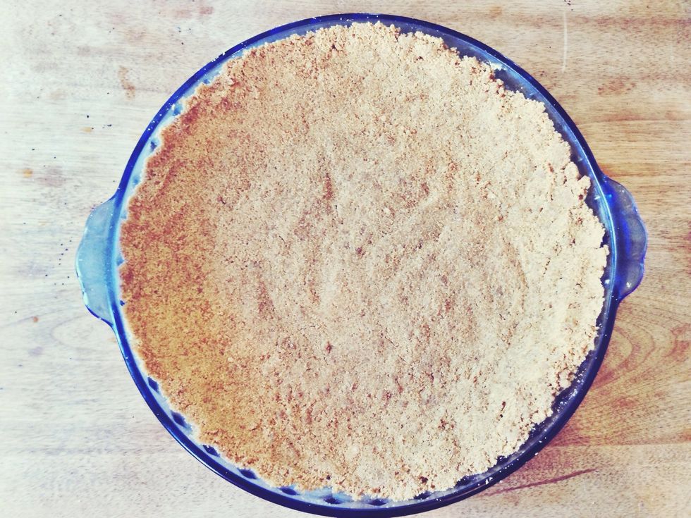 Press into a greased 9inch pie plate and bake at 325 degrees for 8-10 minutes.