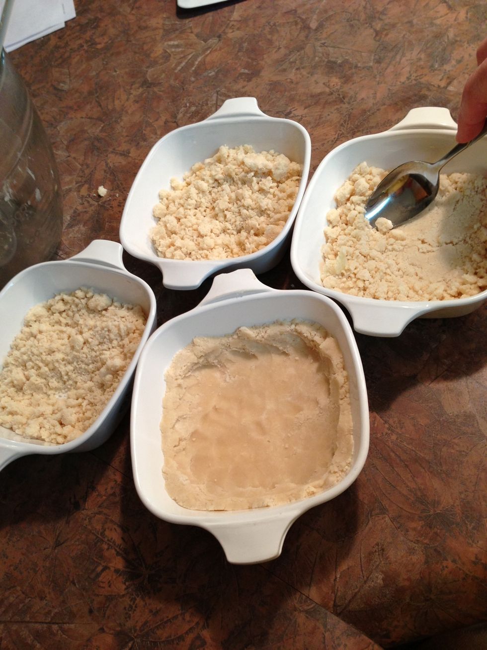 Press into pan(s) to form crust. Preheat oven to 350\u00b0.