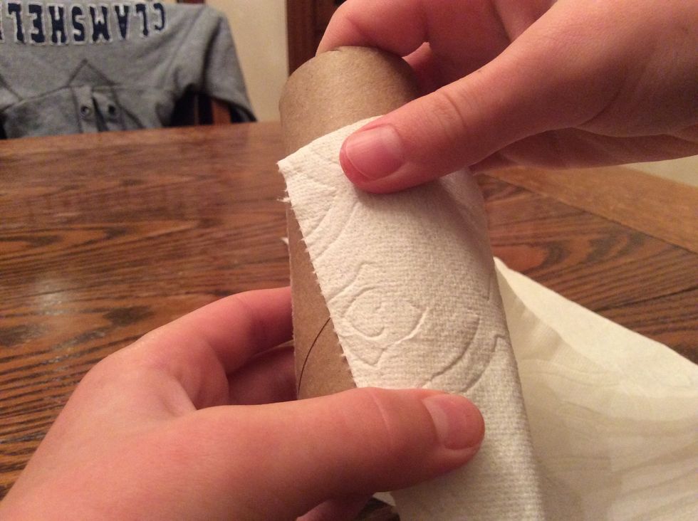 Press it at an angle onto the bottom of the TP roll