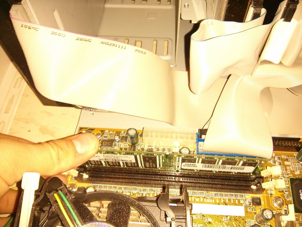 Press it down until it clips the lever should be up automatically.  Do both sides at the se te with even pressure. ( I couldn't  do both sides I was holding a camara