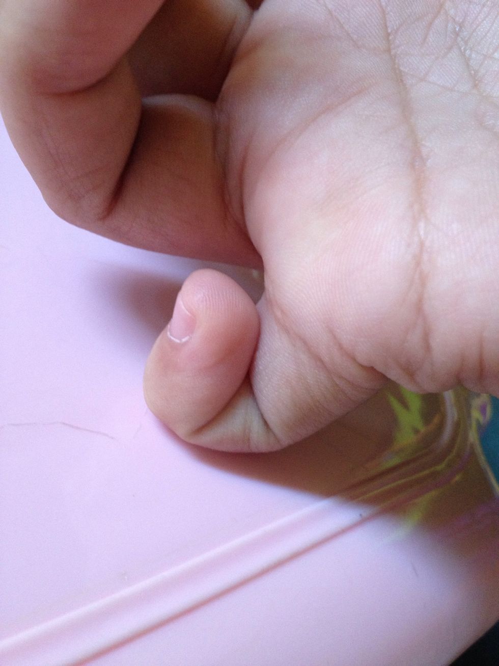 Press it on a flat surface. This will serve as your "stand".