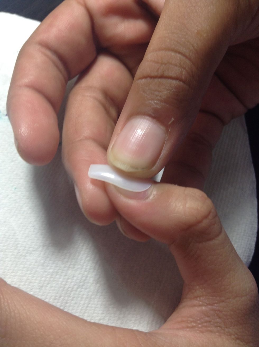 Press it on (without glue) and if it is too small find a size that's a bit bigger or if it is too big find a smaller one.