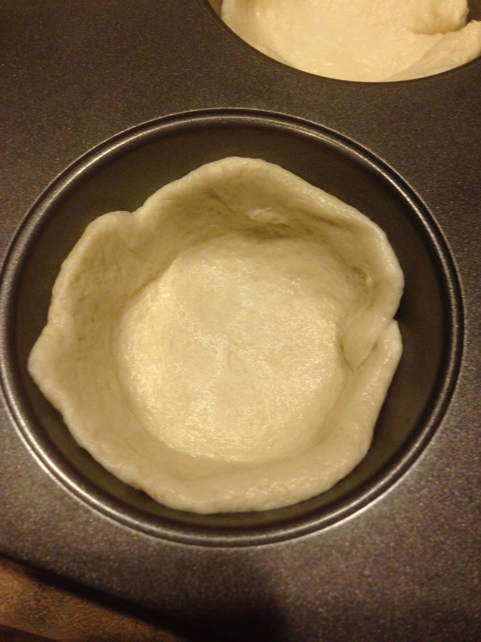 Press one biscuit into each slot on the pan and press up the sides to make a bowl for the other ingredients.