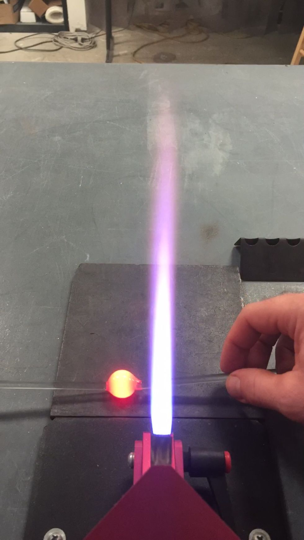 Press one side of the ball onto your graphite marver, flattening it.