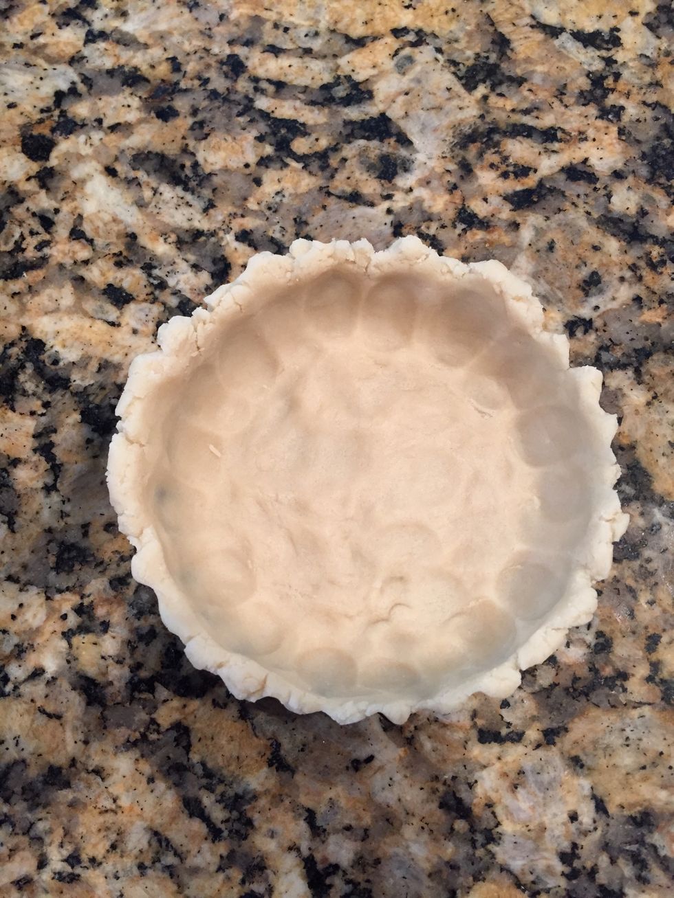 Press out until so that it's about less than 1/2 inch thickness. Don't let the pastry tear any. Press up the sides