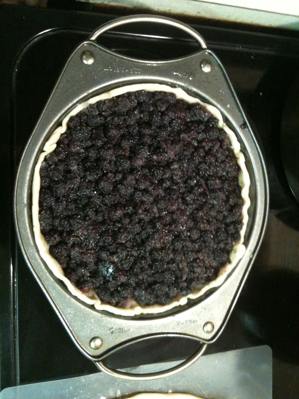 Press pie crust into tin or pie pan , bake at 350 for about 10 minutes  Remove from oven & set aside. In large bowl combine sugar & berries. Coat well.  Pour sugared berries into pie tin