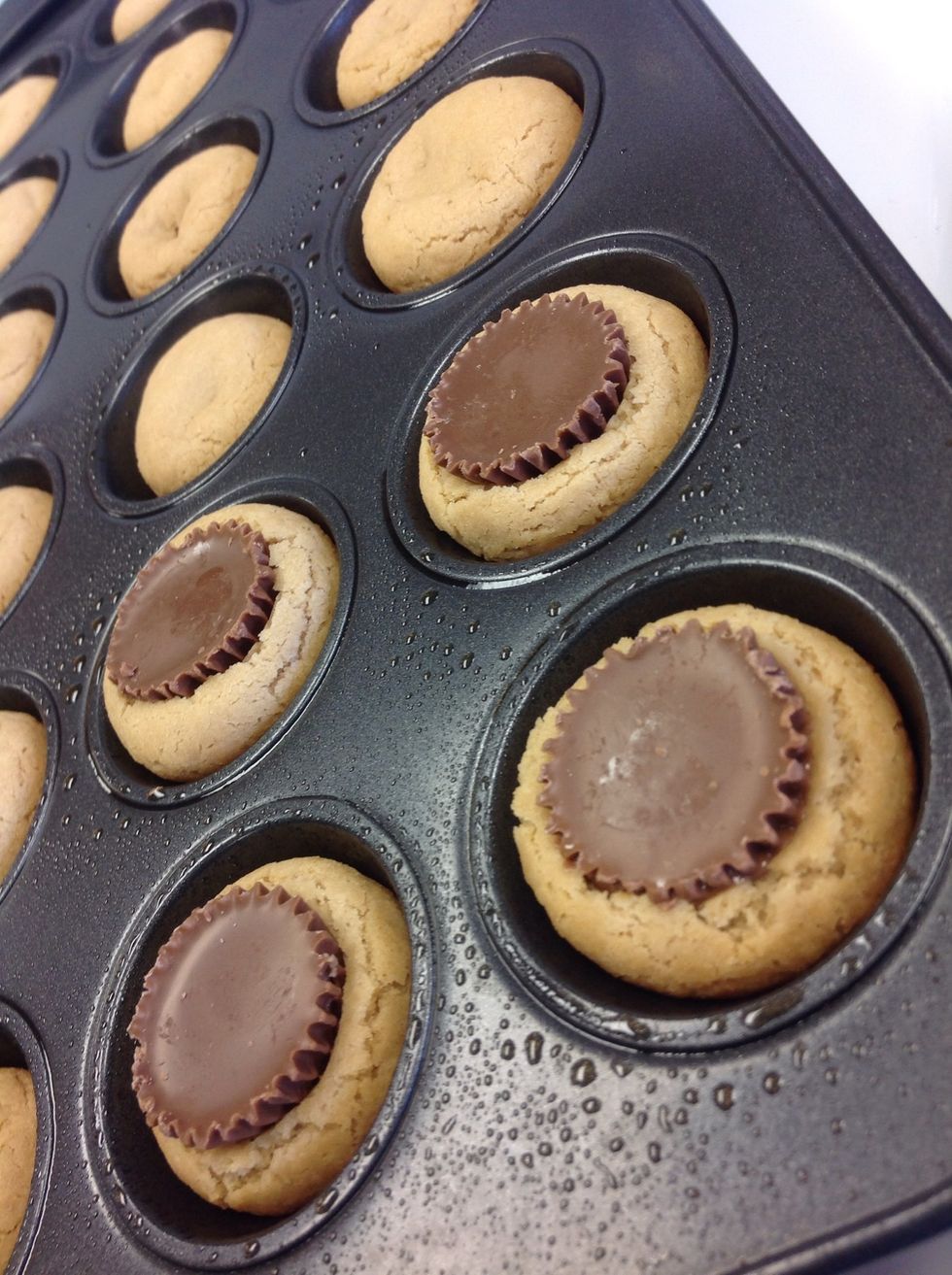 Press Reese's into cookies