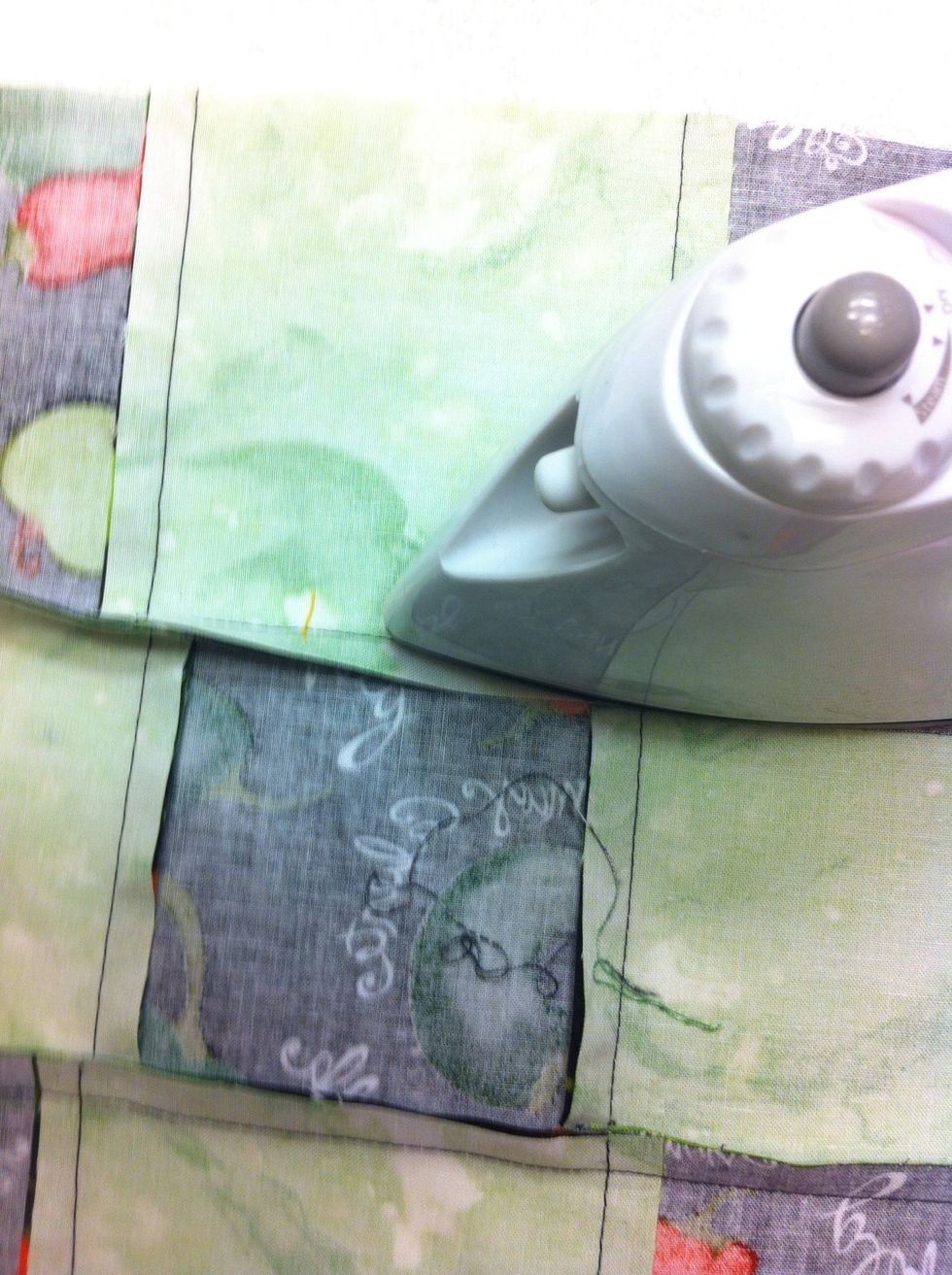 PRESS seam allowances toward outside edge of block.