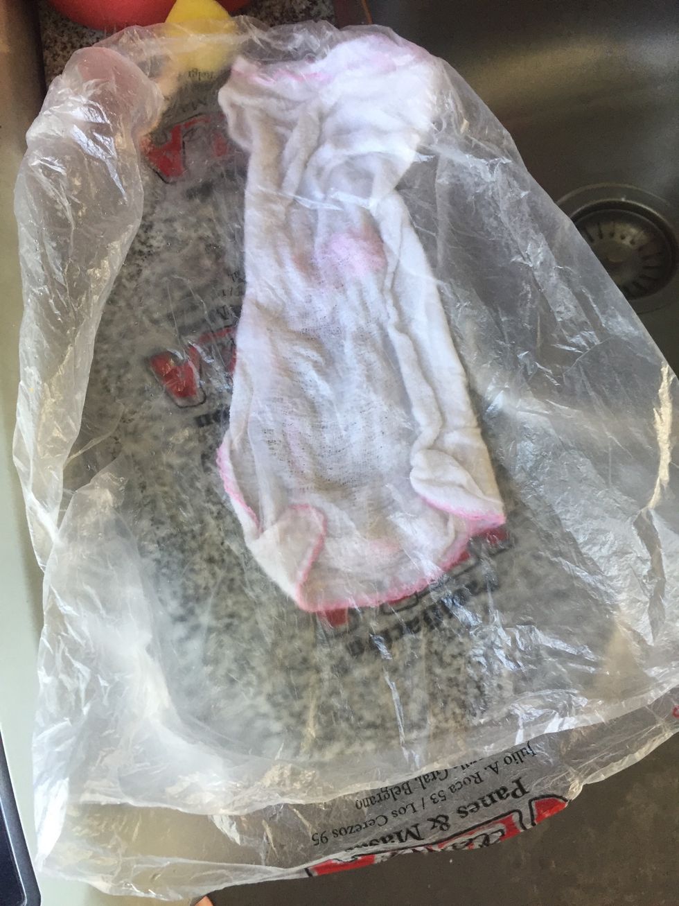 Press the bag against the towel