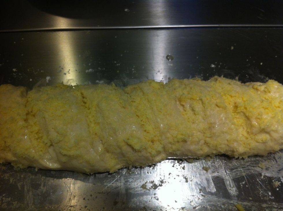 Press the cheese into the egg wash a little so it sticks. Get ready to transfer to the oven. I use my hands so I have better control of how they are arranged on the baking stone.