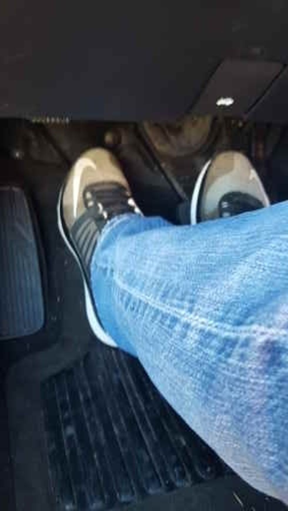 Press the clutch in (and brake if the area is not flat you will roll)