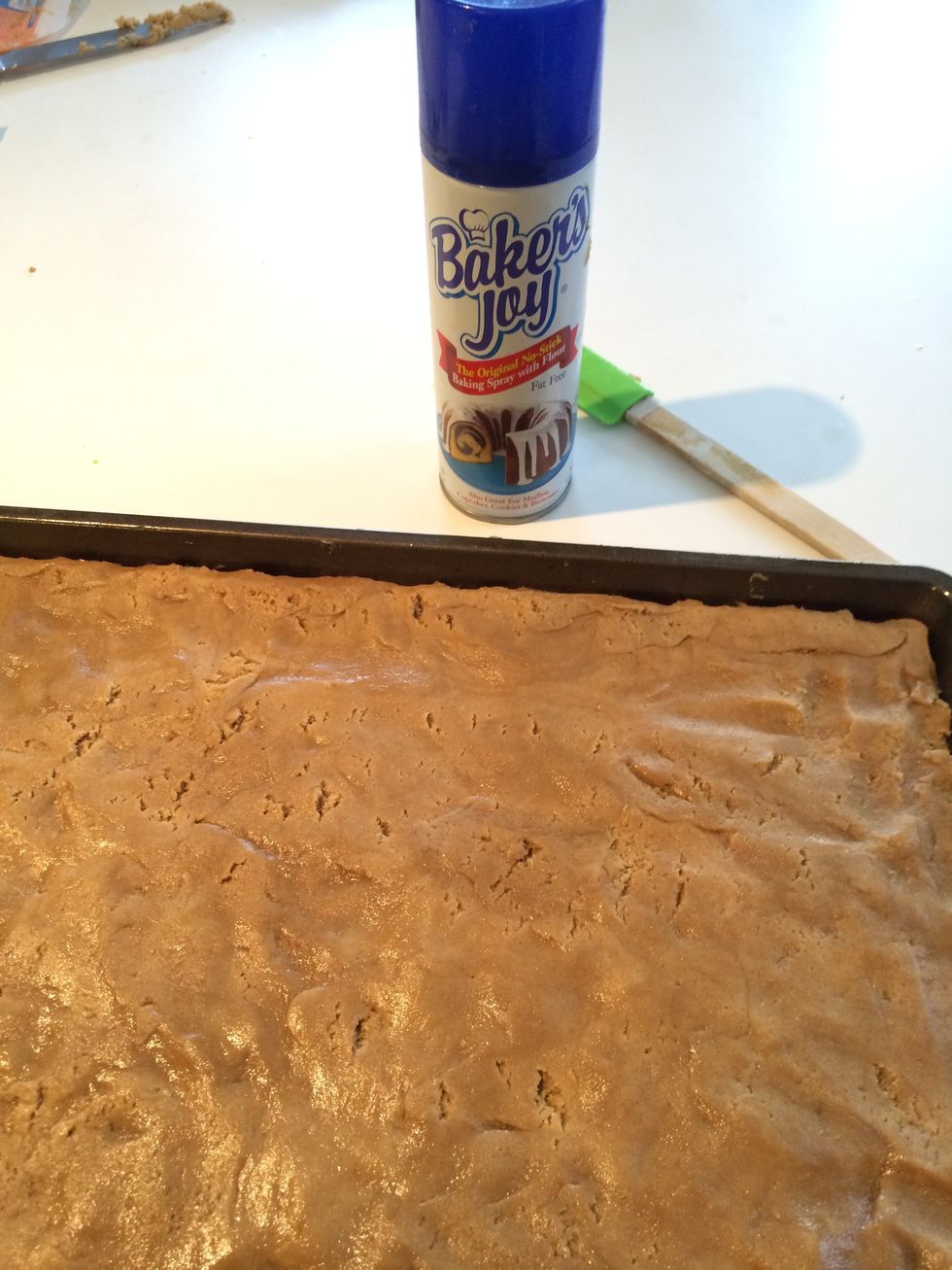 Press the cookie dough in the jelly roll/cookie pan as if you were making bar cookies.  Smooth down any edges next to side of pan - you are aiming for a completely flat surface.