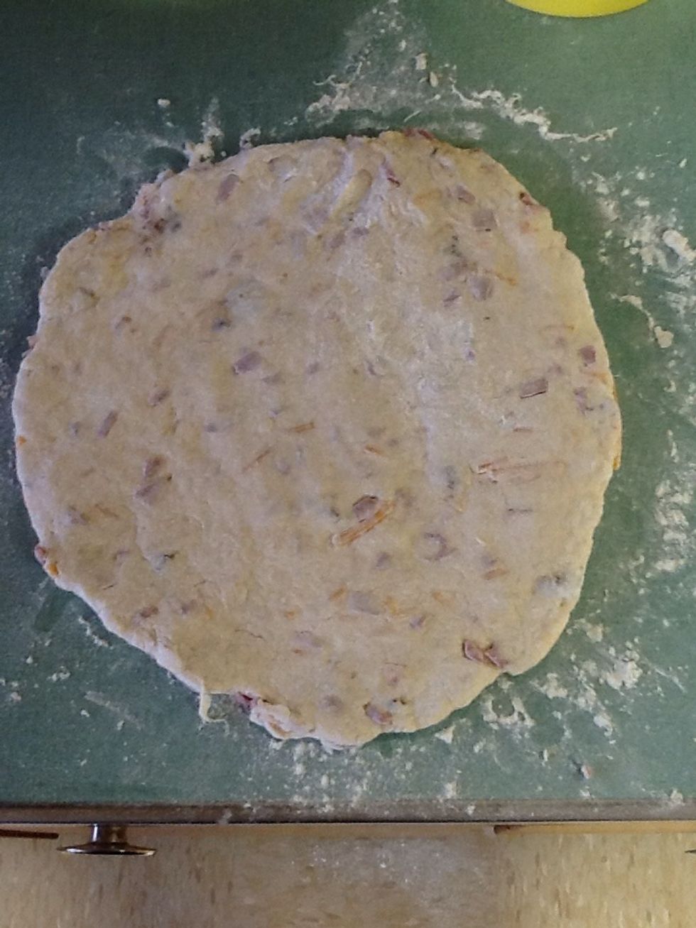 Press the dough down for a 9 inch circle then get a pan ready for it.