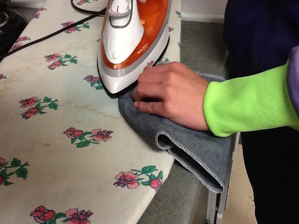 Press the fabric away from the zipper tape.