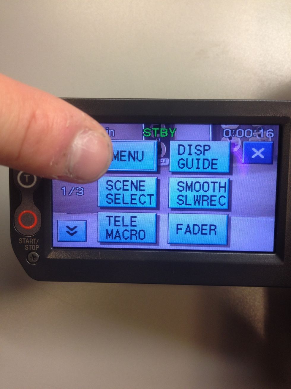 Press the MENU button.