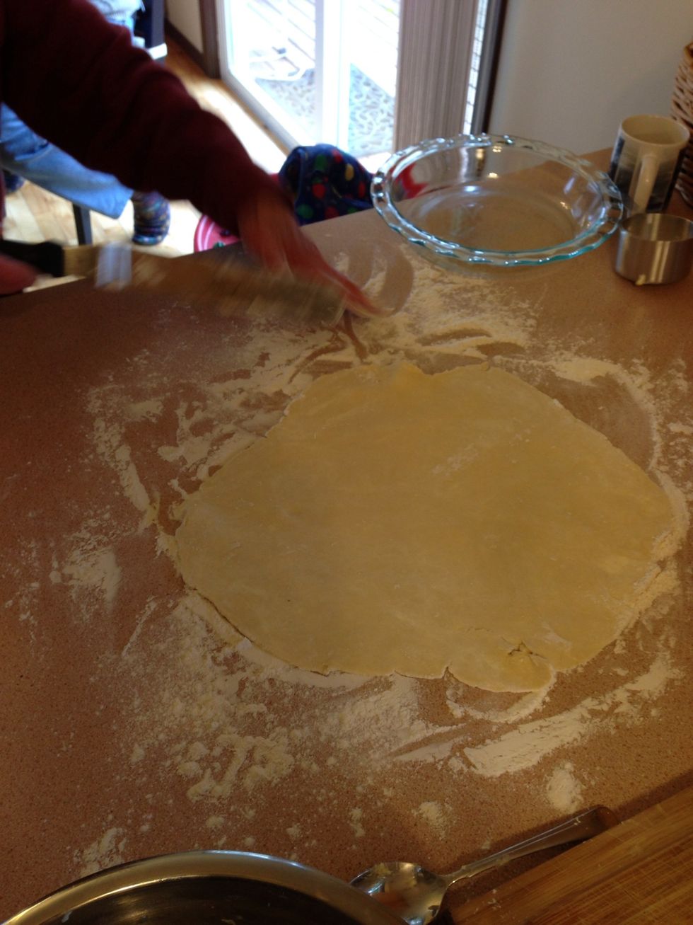 Press the other dough ball together into a disc and roll it out on a heavily floured surface. This will be for the top.
