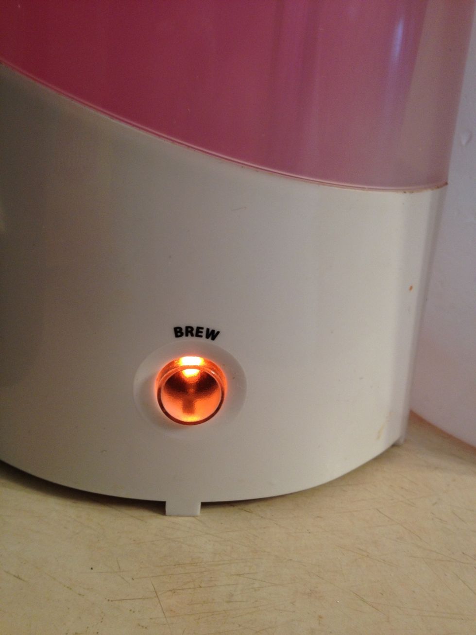 Press the power button...at this point do not touch the Iced Tea Maker because it will be VERY HOT and STEAMY! Are we still talking about tea here???!!!