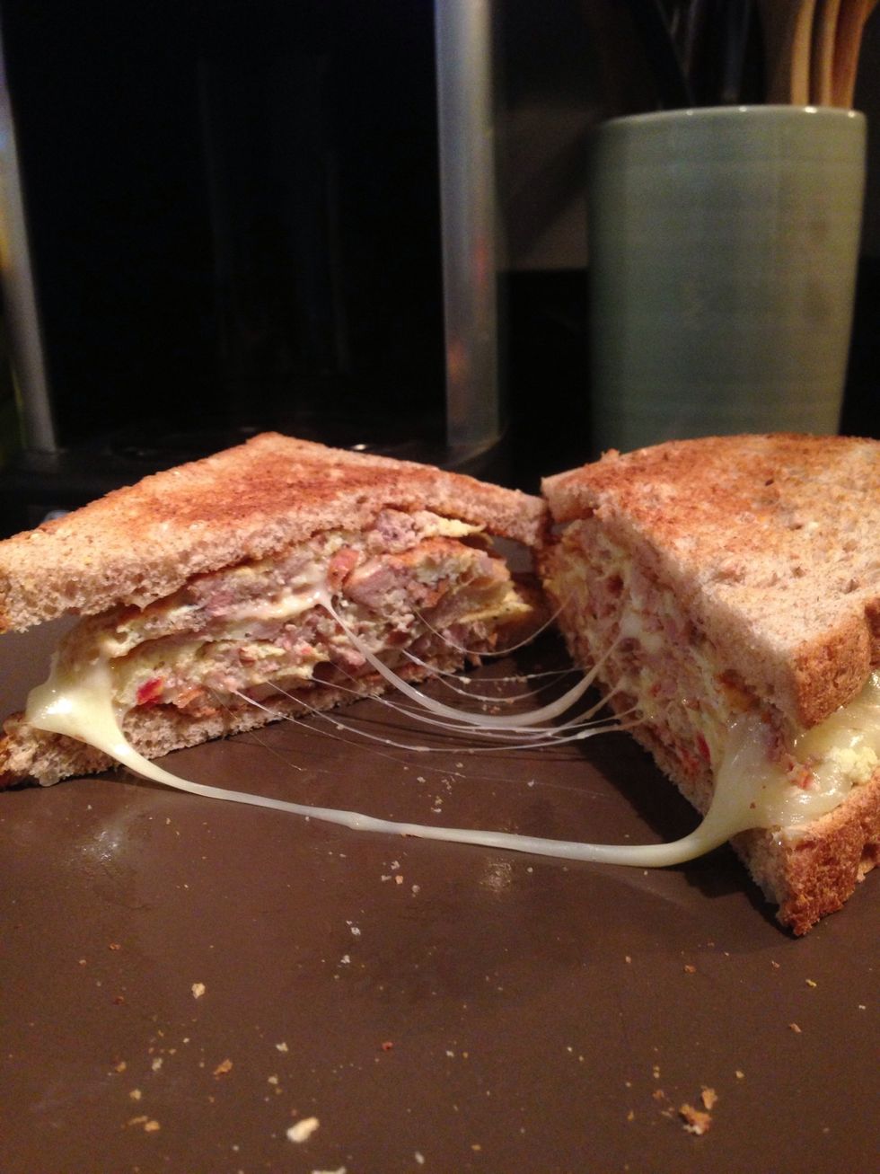 Press the sandwich together, cut it in half diagonally, pull apart and voila! Delicious! Enjoy